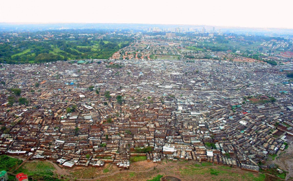 What is it like to visit the largest slum in Africa? Discover what a Kibera slum tour is like, the ethics of your visit, & the inspirational people you will meet on the way. | Kibera charity | Where is Kibera | Living conditions in Kibera | Kibera housing project | Kibera children | Problems in Kibera | Kibera slum population | Improving Kibera | Kibera population | Life in Kibera | African slums | Kibera shanty town | Kibera slum Kenya | Life in Kibera slums #kibera #kenya #nairobi